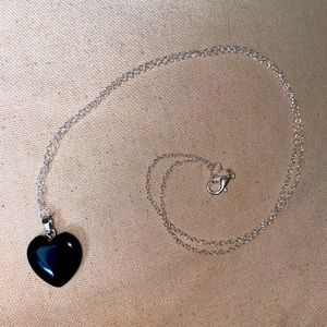 Black onyx gemstone pendant in a heart shape